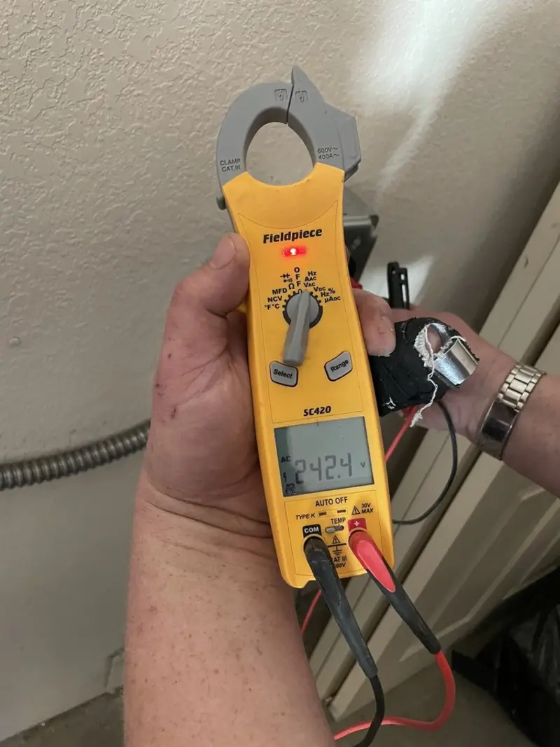 Voltage testing with clamp meter during Electrical Installation Services in Largo